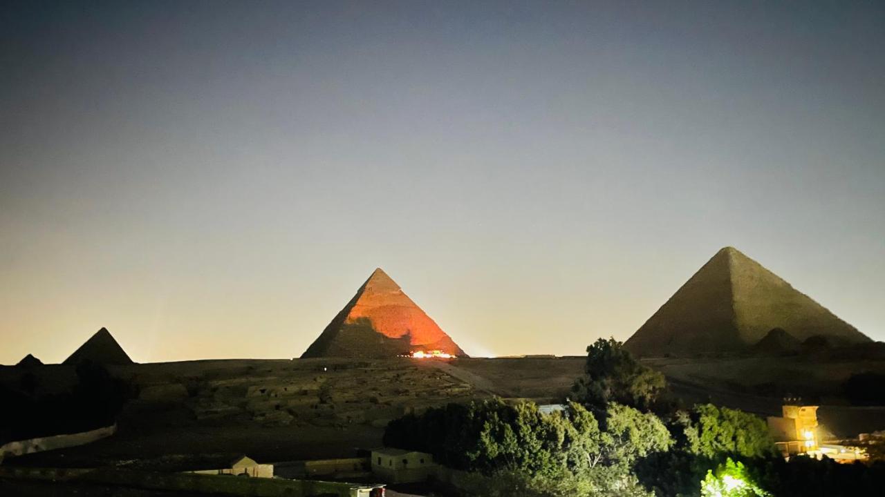 Sphinx Palace Pyramids View
